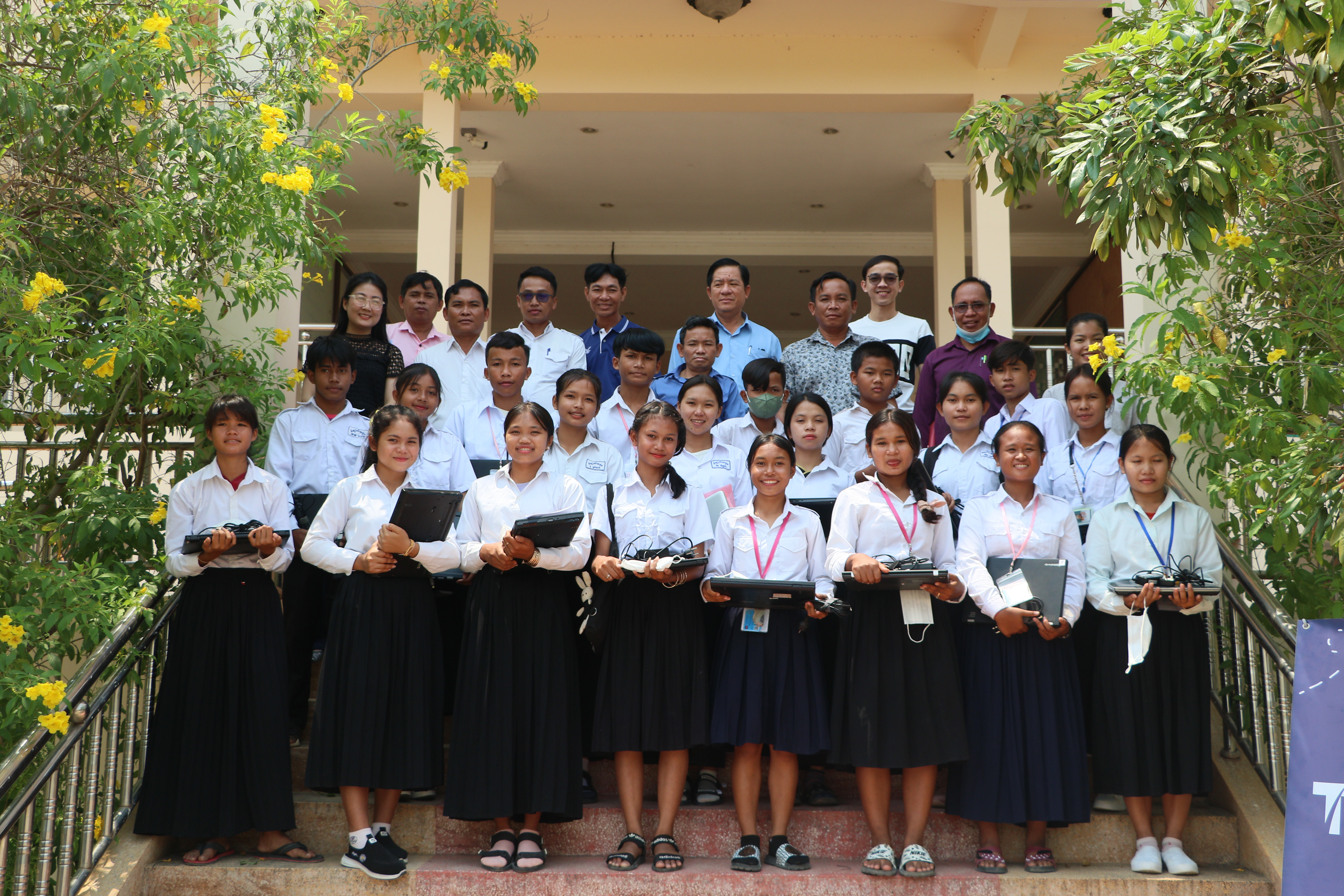Students receiving their laptops and computers